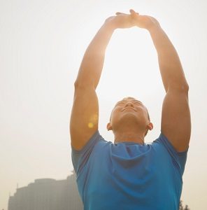 Young Muscular Man Stretching