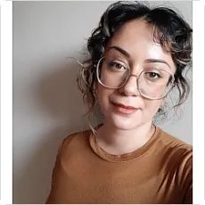 azin heydari, registered Psychotherapist, specializing in Interpersonal Neurobiology, wearing glasses, in a friendly headshot portrait.