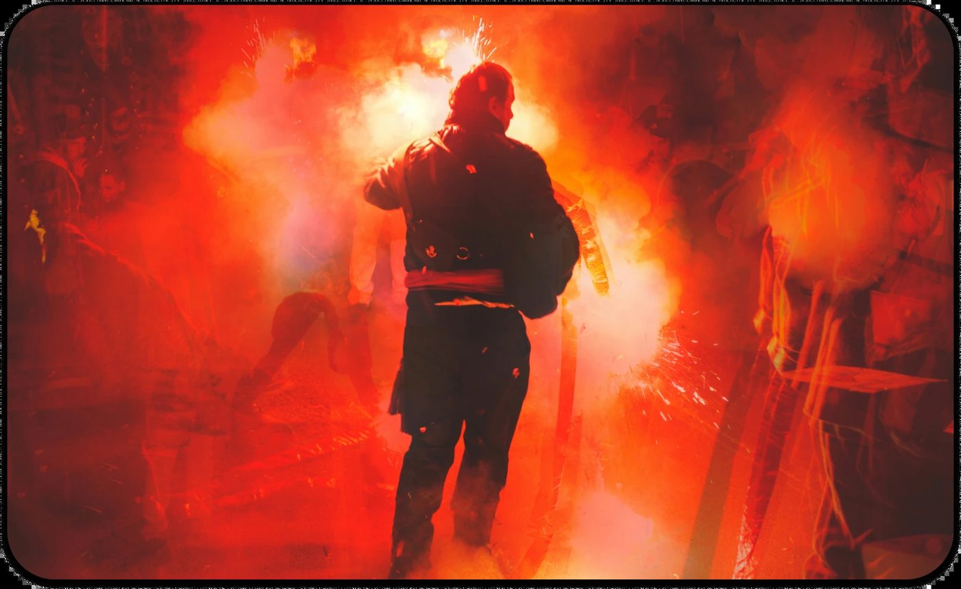 Firefighter surrounded by smoke and flames, symbolizing preventive trauma treatment for first responders.