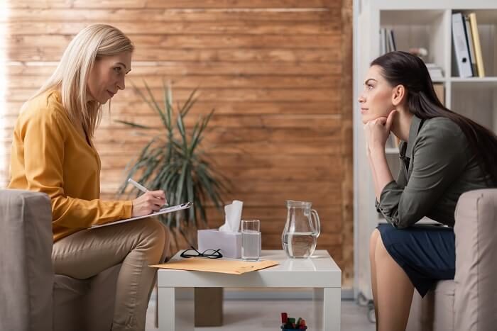Therapist working with neurotypical partner in therapy
