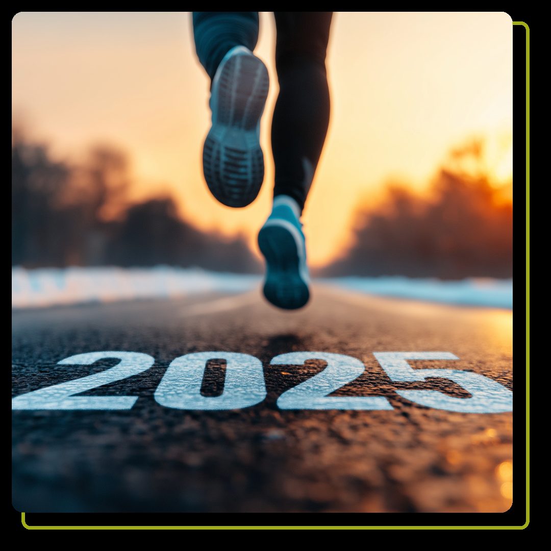 Runner's feet on road with 2025 text at sunset