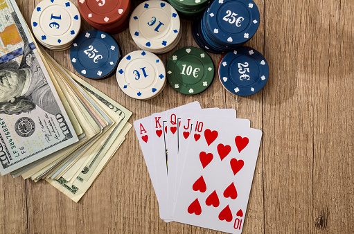 Cards, money, and poker chips