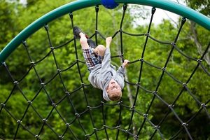 Boy hanging upside down
