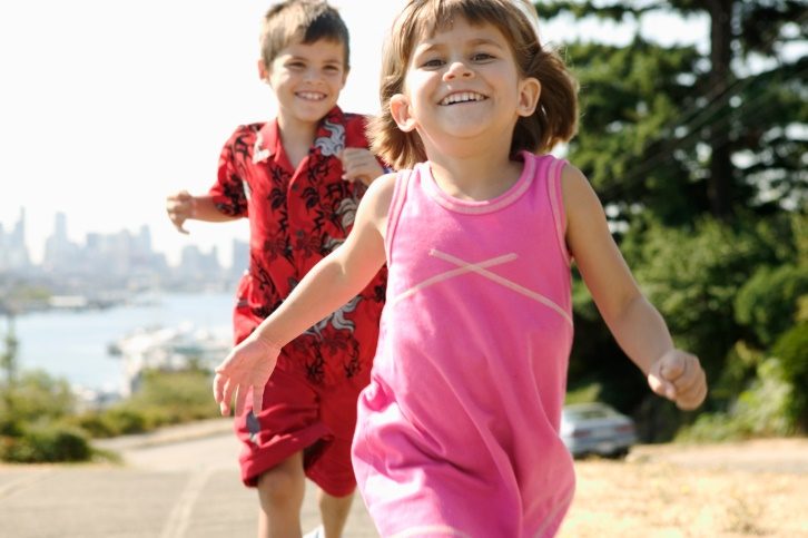 young boy chasing young girl