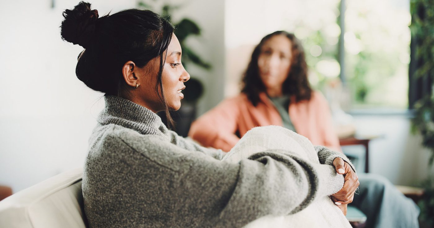 A person speaking with a therapist, representing healing after suffering with compassionate support.