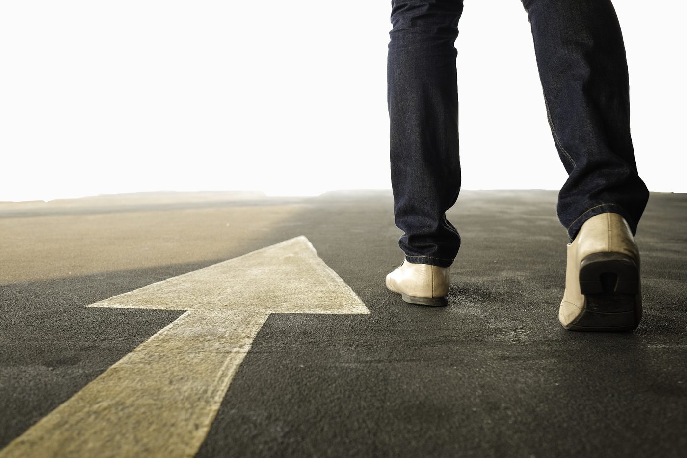 Person walking where arrow is pointing