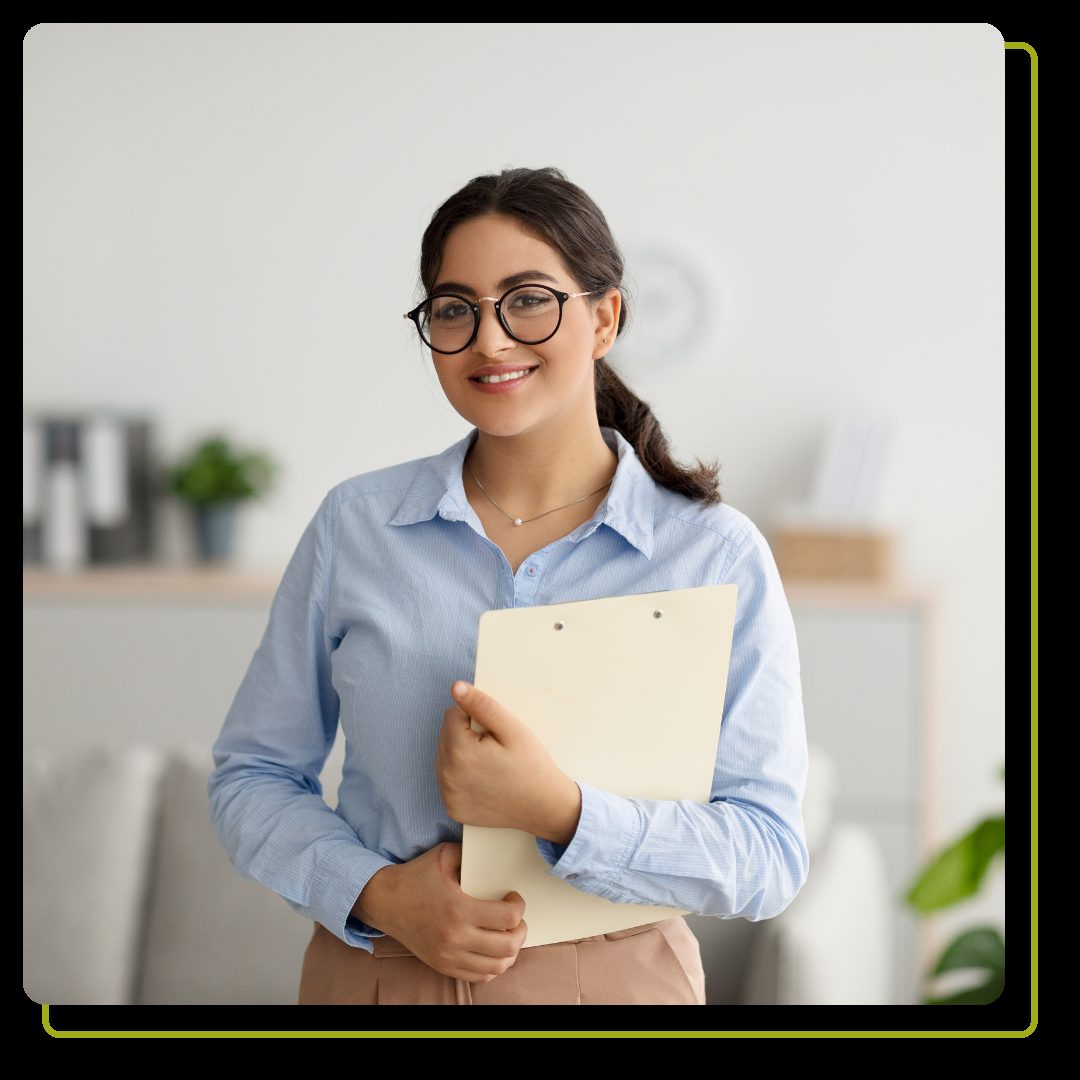 Portrait of happy female psychologist smiling at camera during therapy session
