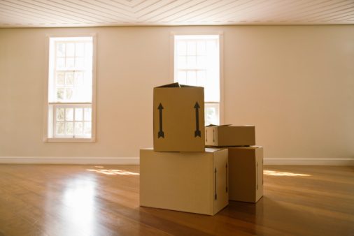Moving boxes in empty room