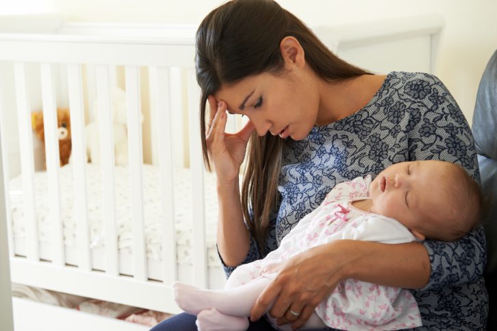 tired mother with child
