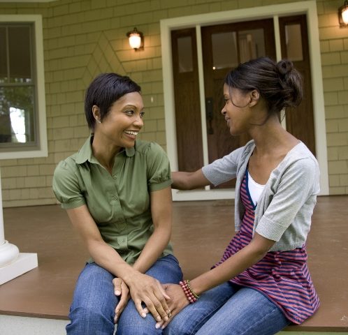 Women talking on front porch