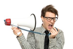 Man yelling in megaphone at himself