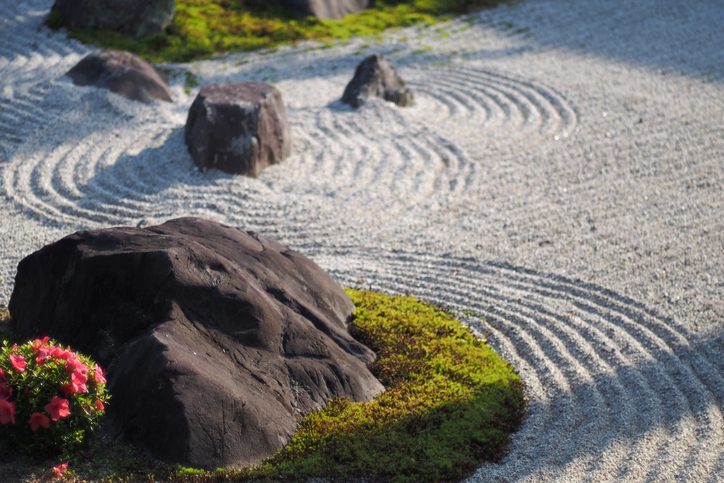 Zen rock garden with raked-over gravel