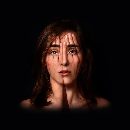 Girl covers face with transparent hands