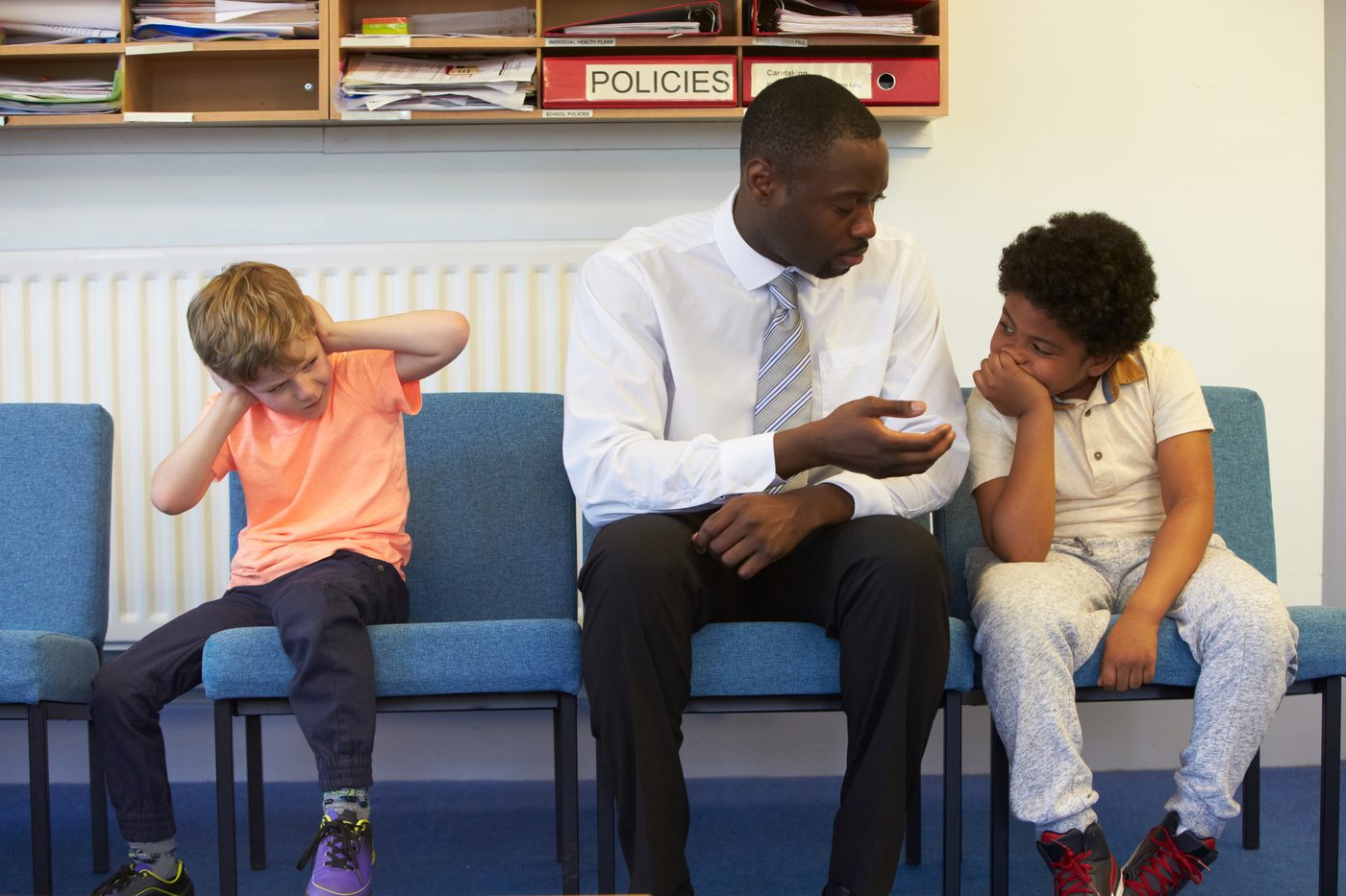 Teacher resolving fight between students