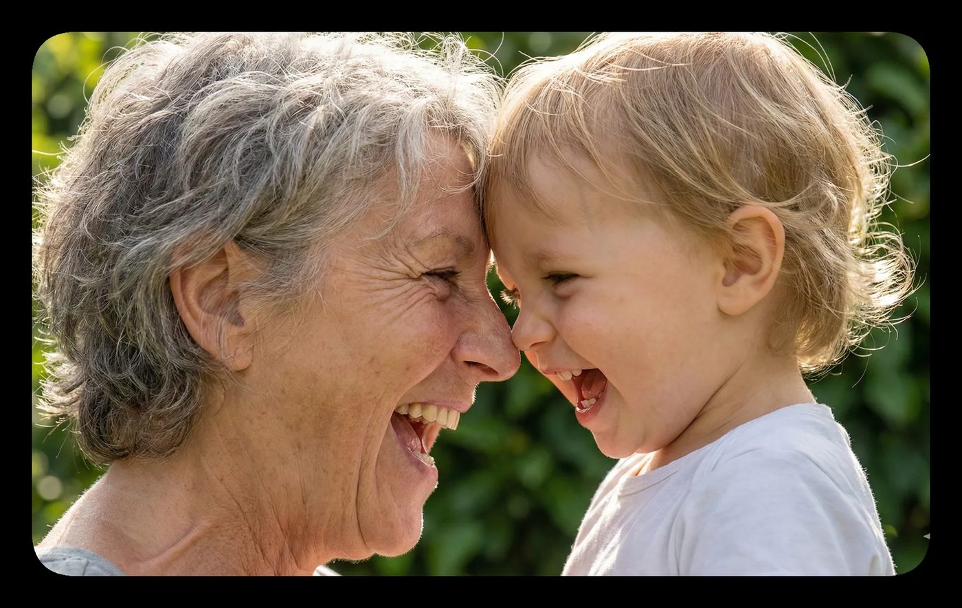 Smiling grandmother and grandchild touching foreheads, sharing laughter, embodying the connection central to interpersonal neurobiology.