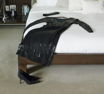 Black dress and purse on bed