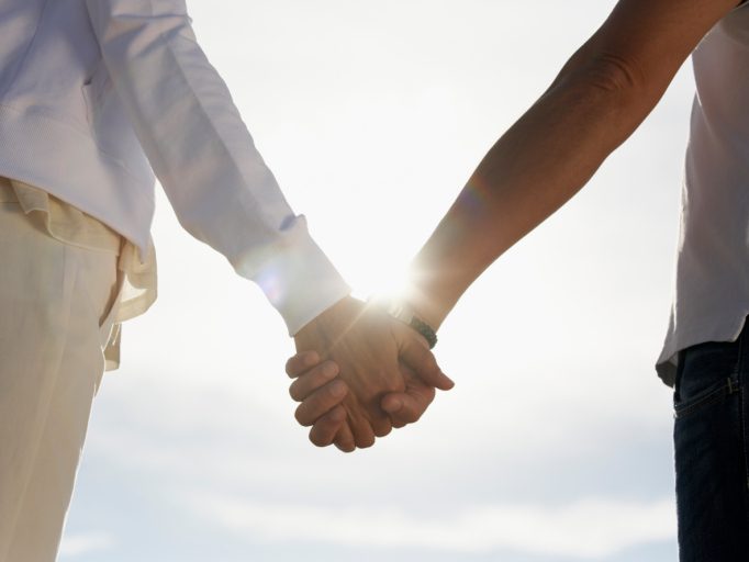 Couple Holding Hands Outdoors