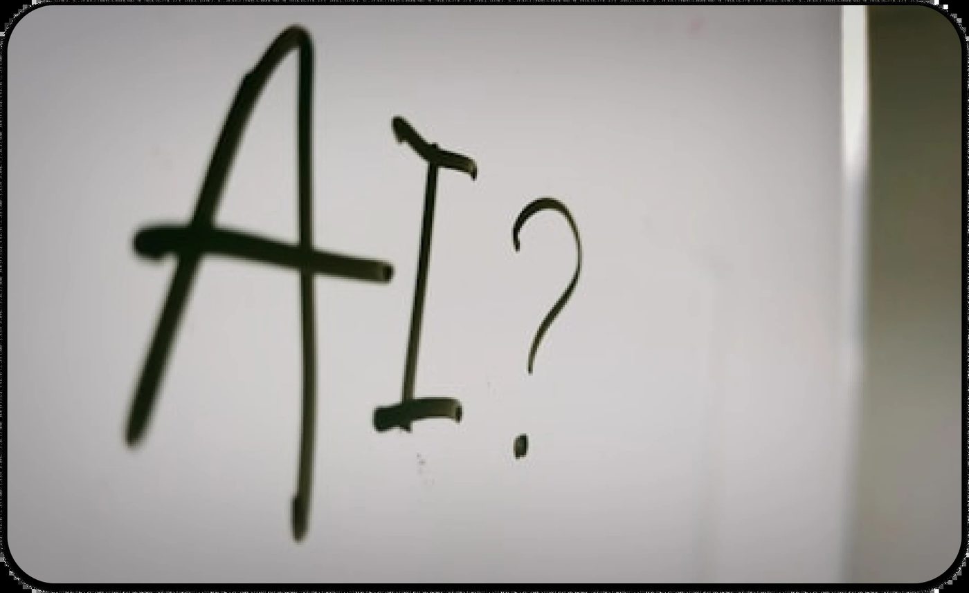 Handwritten text “AI?” on a whiteboard, symbolizing questions about artificial intelligence in therapy.