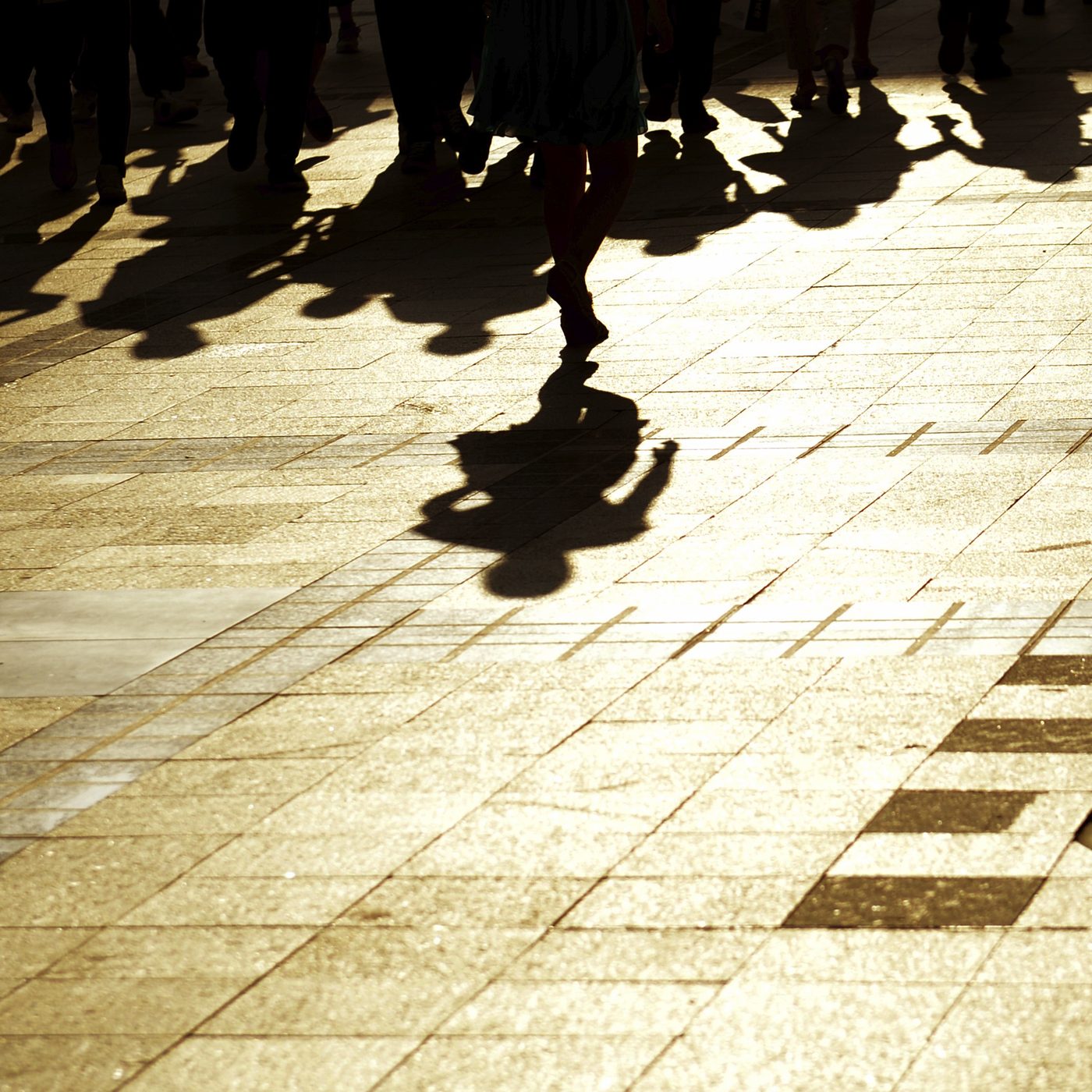 people emerging from shadows